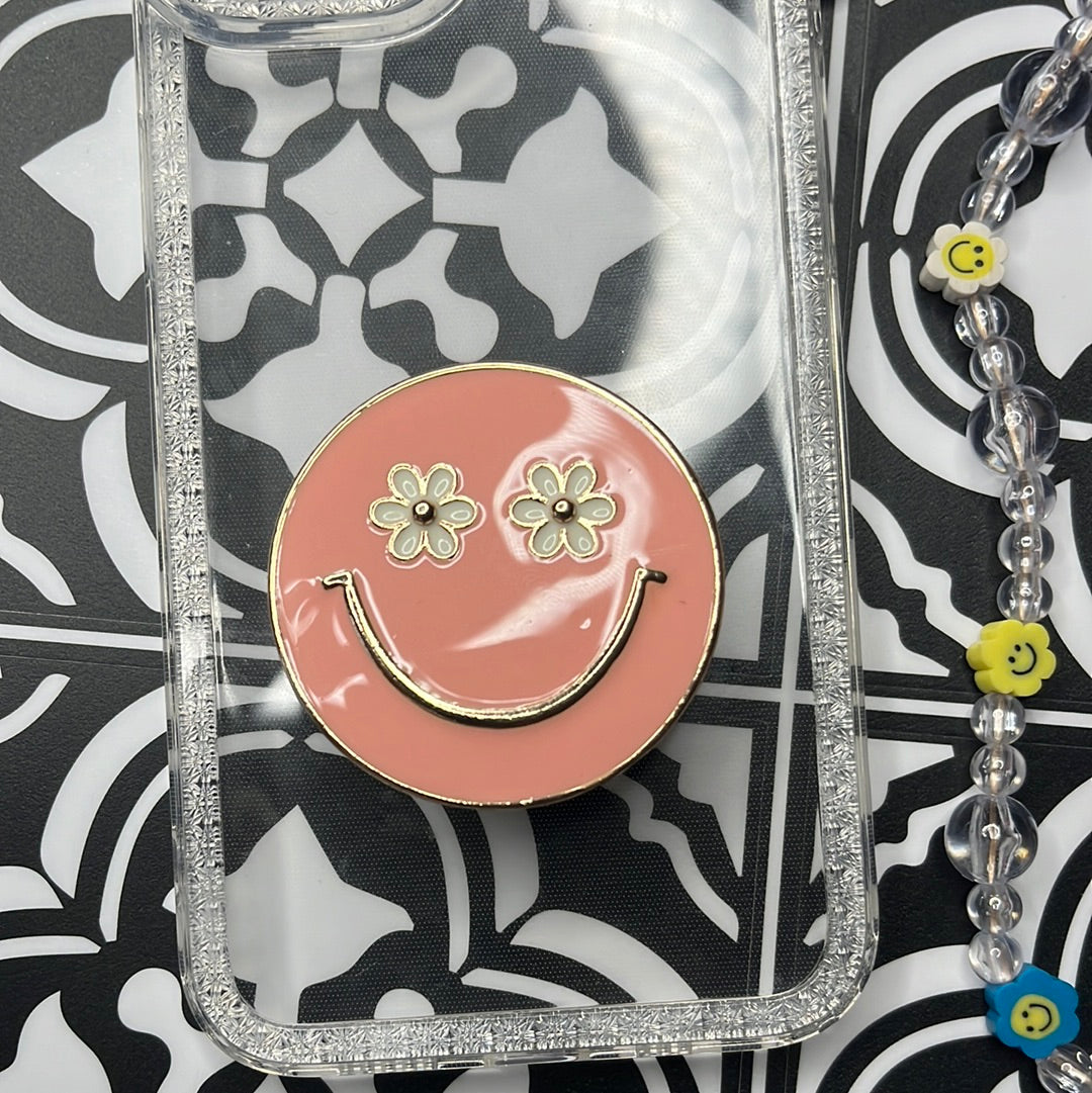 Pink smiley face pop grip